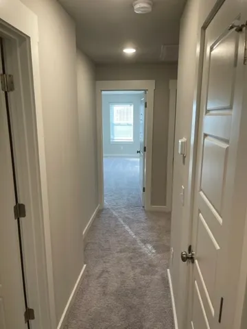 a view of hallway with shower