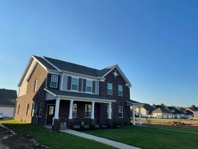 a view of a yard in front of a house