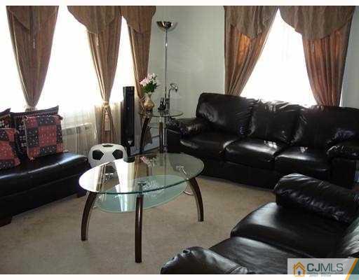 12 Old Post Road Edison, NJ 08817 - Photo 4 of 10 a living room with furniture and a window