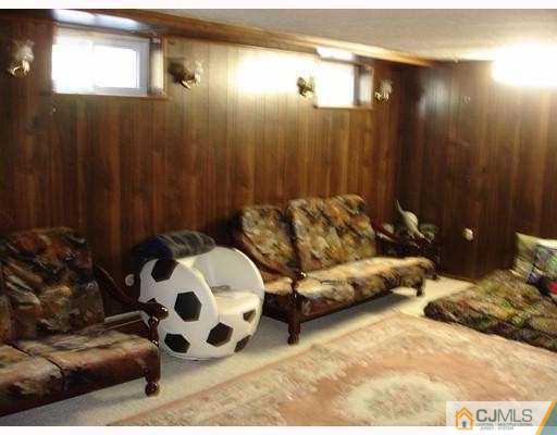 12 Old Post Road Edison, NJ 08817 - Photo 8 of 10 a bedroom with a bed and a painting on the wall