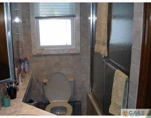 12 Old Post Road Edison, NJ 08817 - Photo 9 of 10 a bathroom with a sink and a mirror
