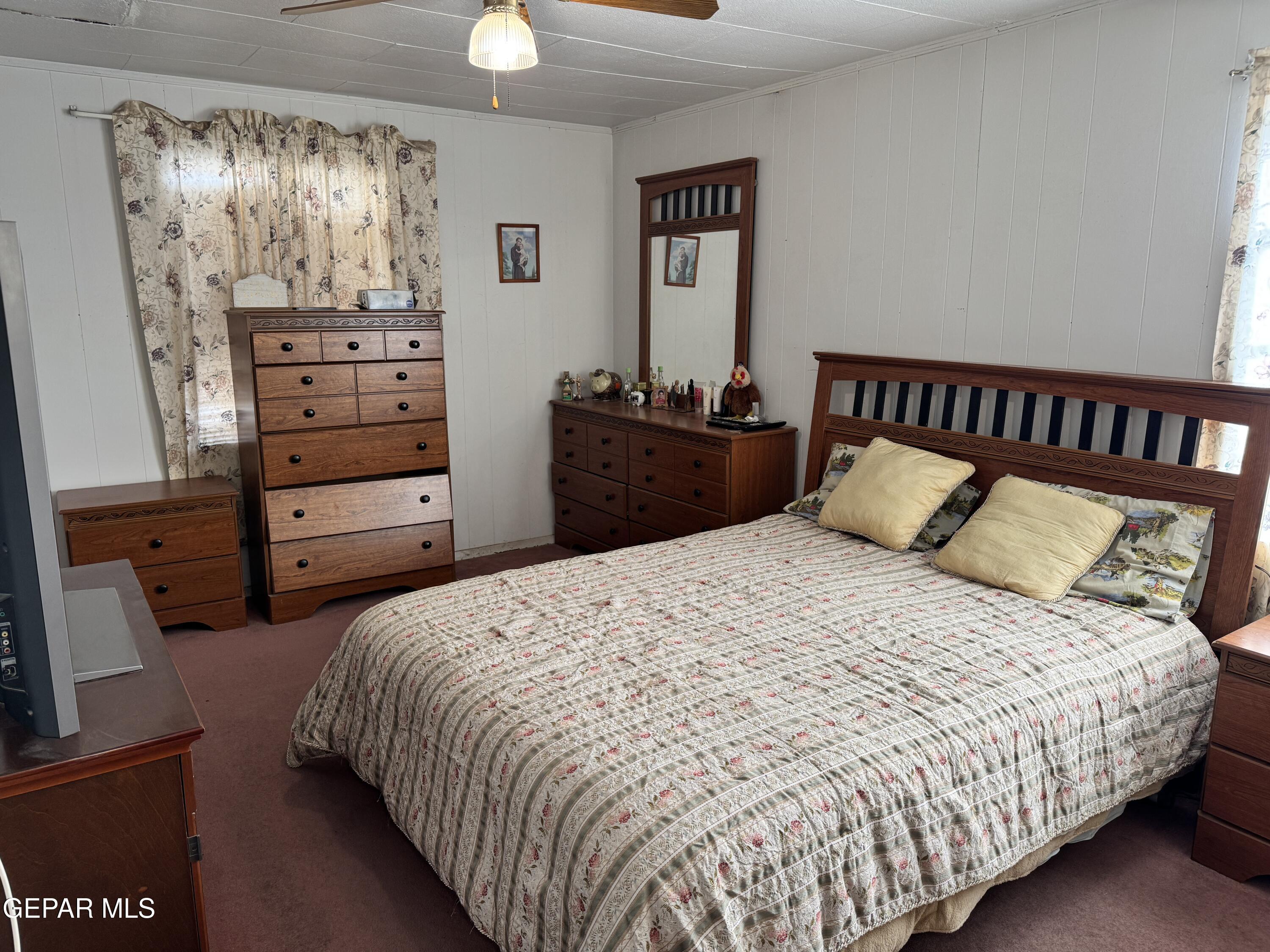 316 St Anthony Street Anthony, NM 88021 - Photo 14 of 29 a bedroom with a bed and a window