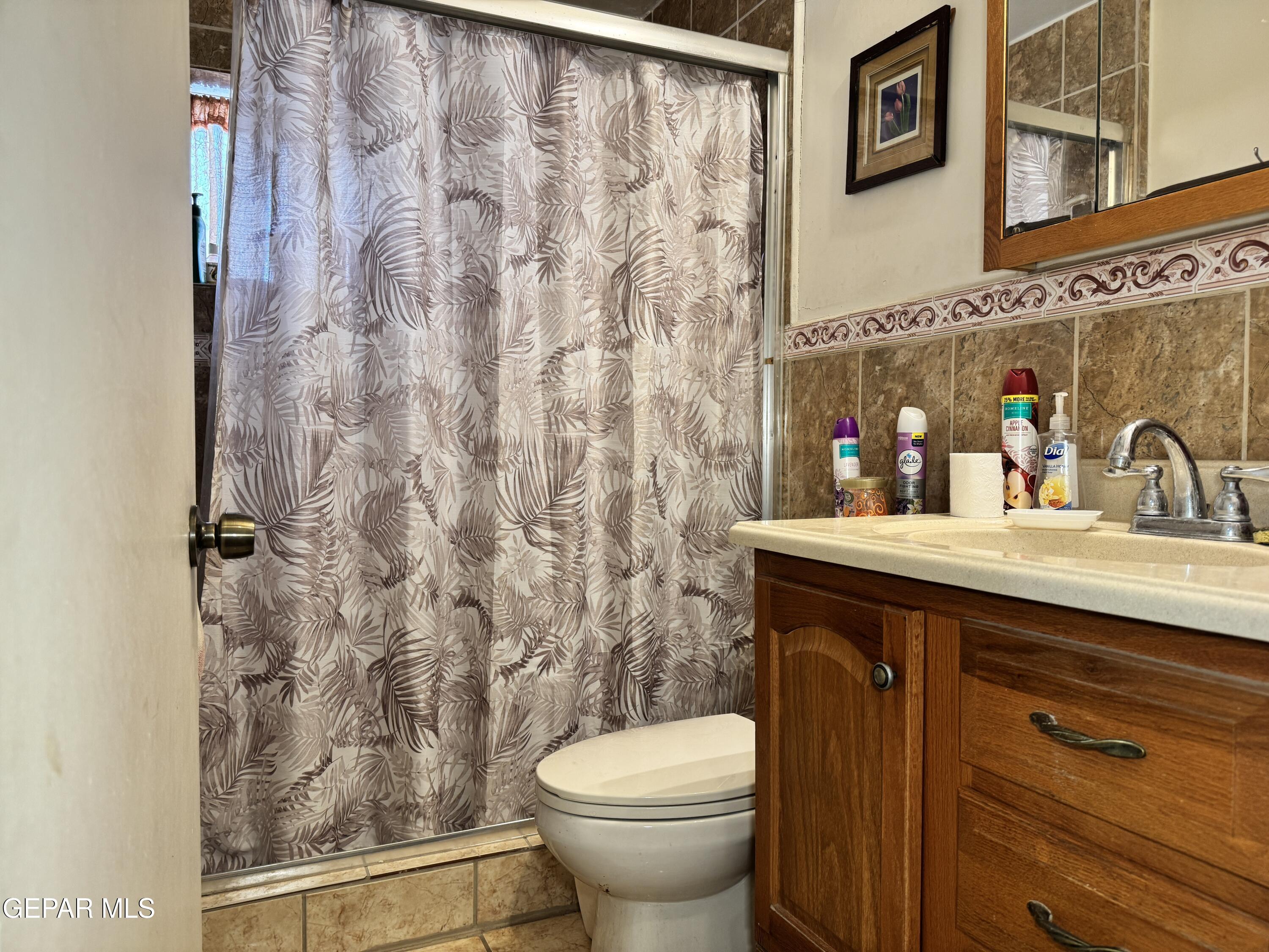 316 St Anthony Street Anthony, NM 88021 - Photo 21 of 29 a bathroom with a sink and a toilet