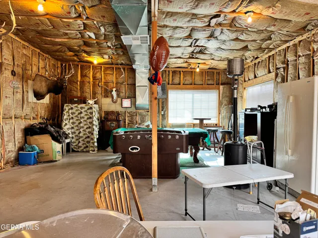 a view of a chairs and tables in patio