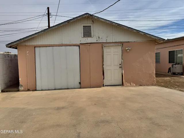 a view of an house with wooden wall