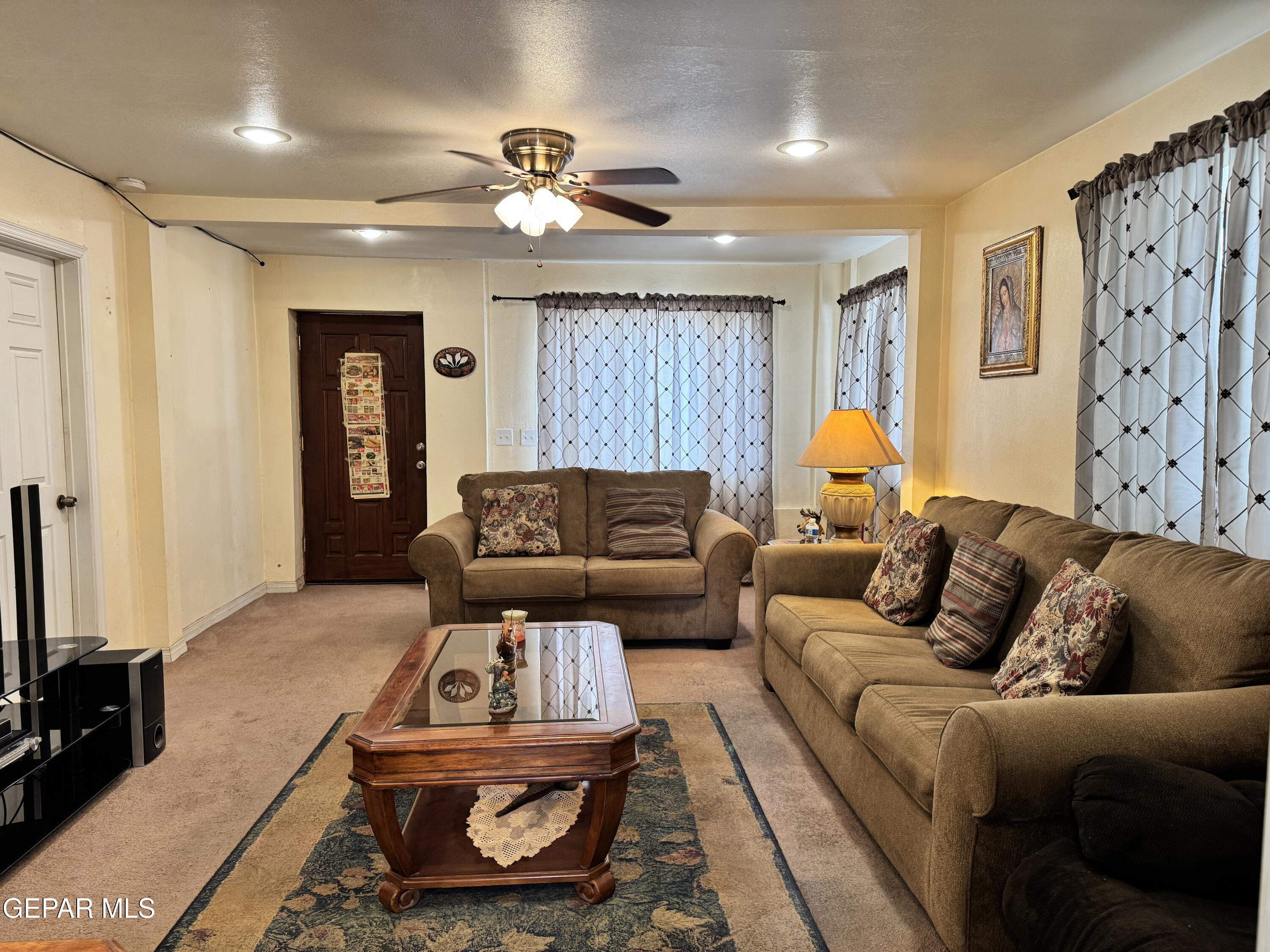 316 St Anthony Street Anthony, NM 88021 - Photo 4 of 29 a living room with furniture and a flat screen tv