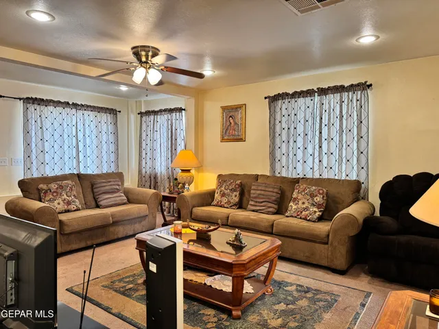 a living room with furniture and a large window