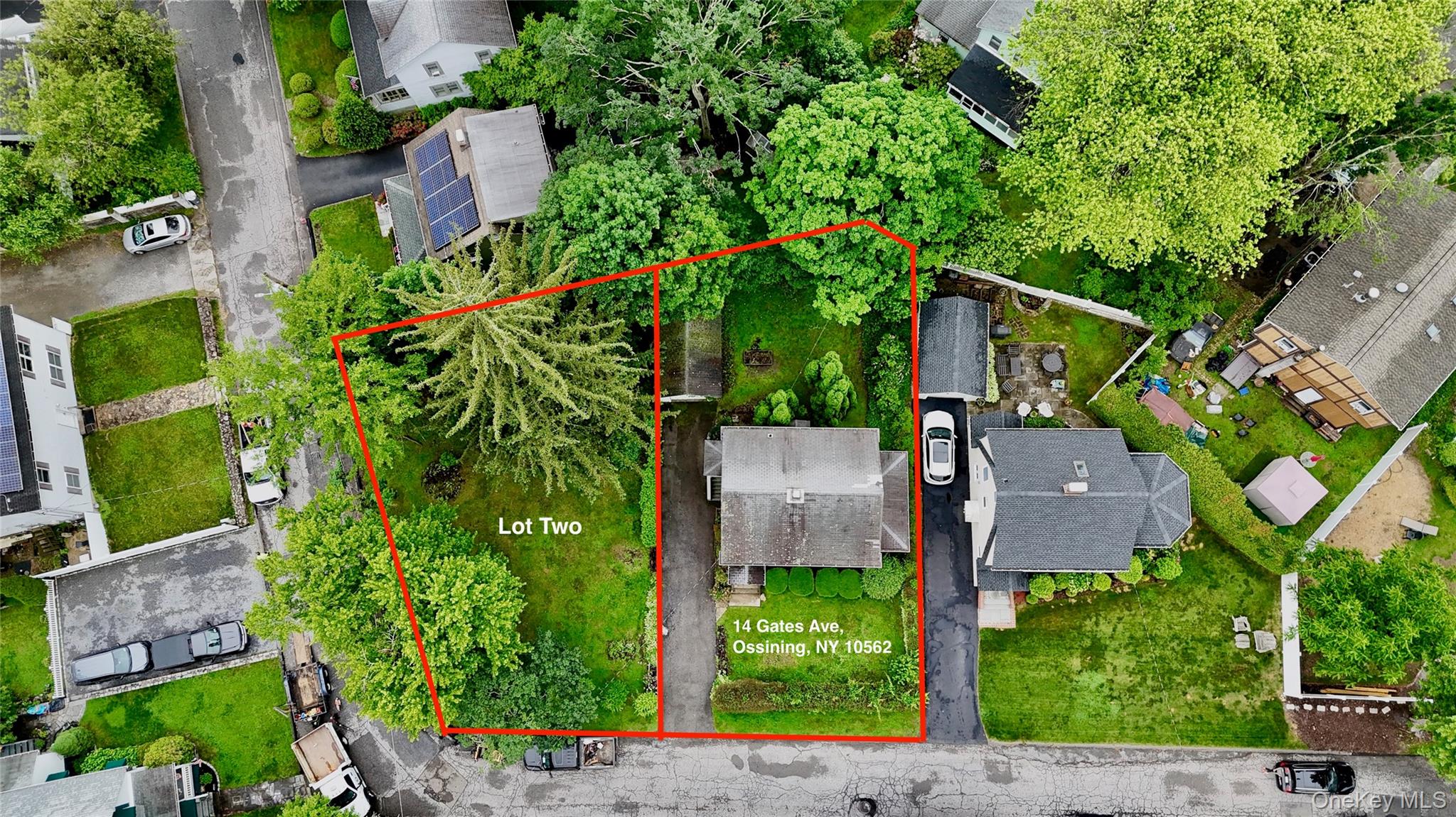 an aerial view of a house with a yard and potted plants