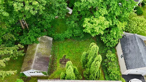 a backyard of a house with lots of green space
