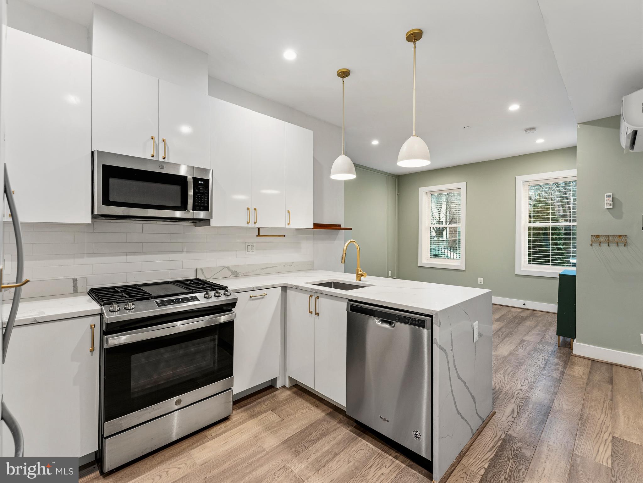 a kitchen with a stove and a microwave
