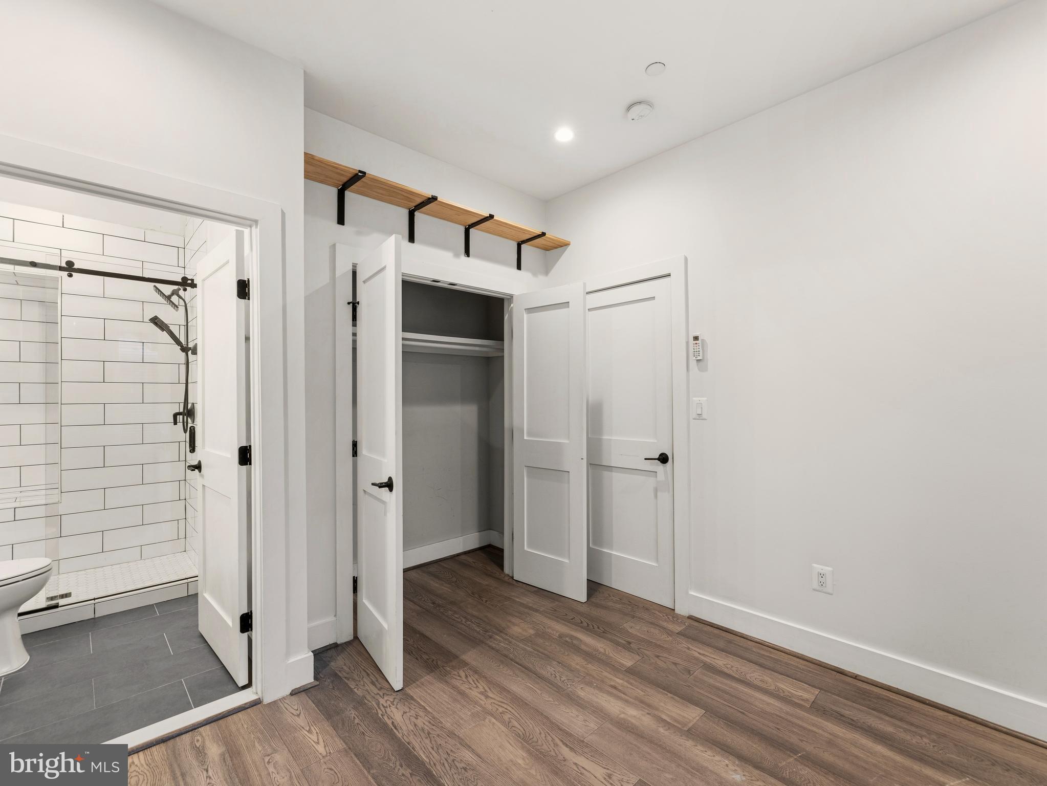 1120 Penn Street Northeast, Unit 2 Washington, DC 20002 - Photo 11 of 14 a view of a hallway with wooden floor and closet area