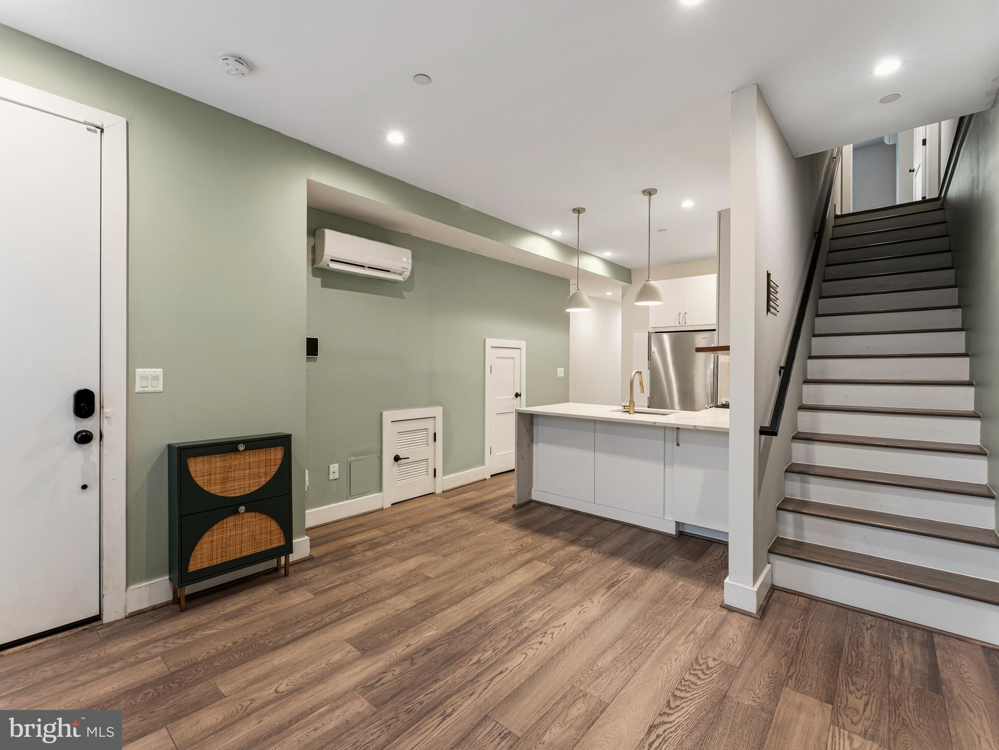 1120 Penn Street Northeast, Unit 2 Washington, DC 20002 - Photo 2 of 14 a view of an empty room and wooden floor