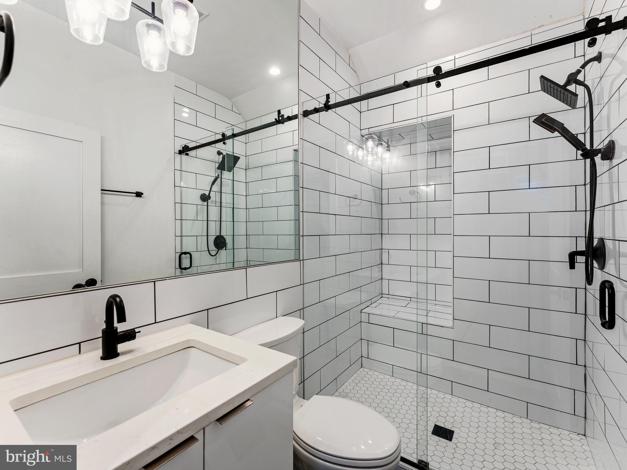 1120 Penn Street Northeast, Unit 2 Washington, DC 20002 - Photo 10 of 14 a bathroom with a sink toilet and shower