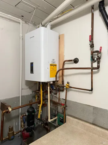 a view of a room with furniture and wooden floor