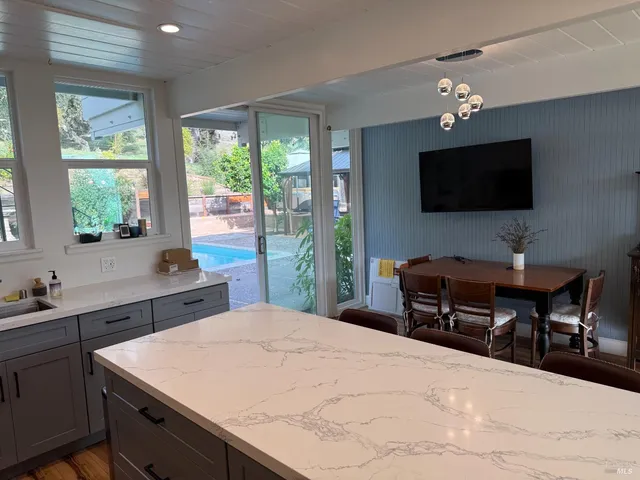 a room with a large bed and a flat screen tv