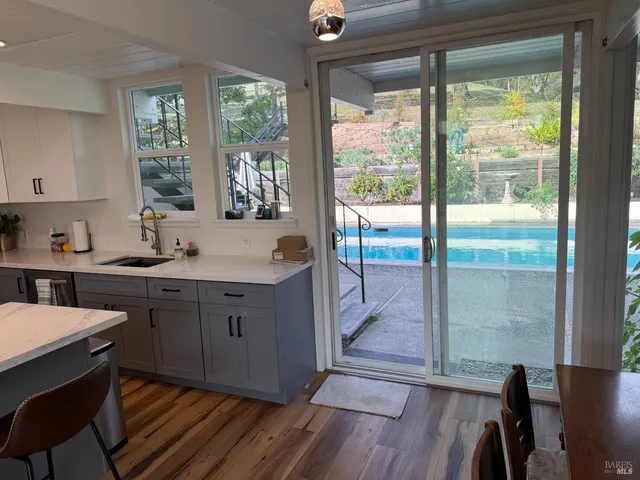 a kitchen with a sink and wooden cabinets