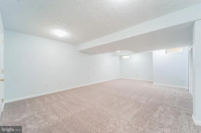 a bathroom with a toilet a sink a vanity and mirror