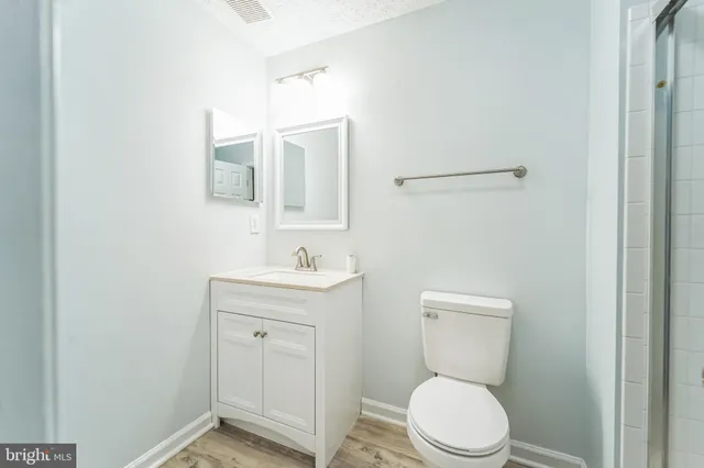 a view of a house with backyard porch and sitting area