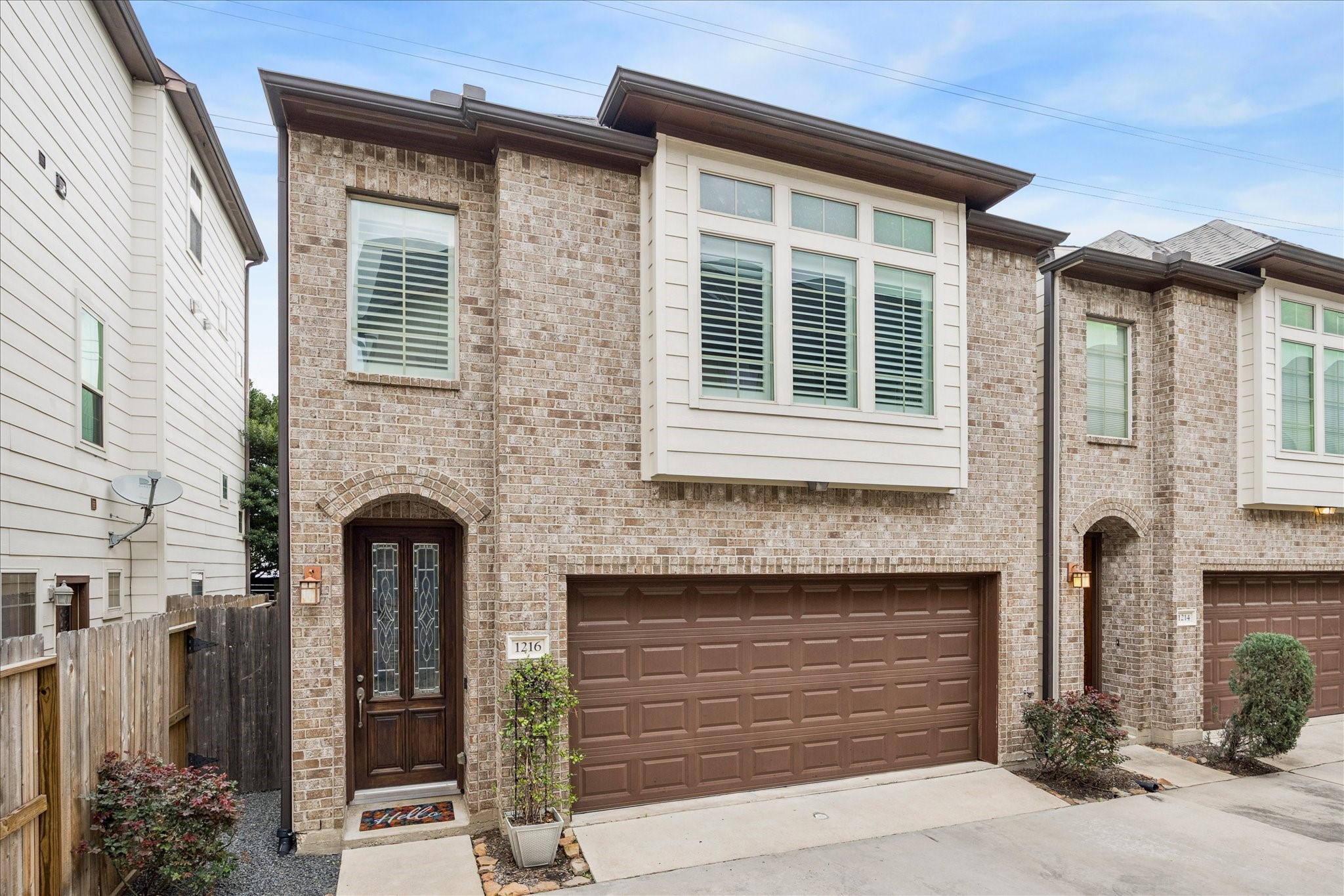 1216 Sampson Street Houston, TX 77003 - Photo 1 of 36 a front view of a house with garage