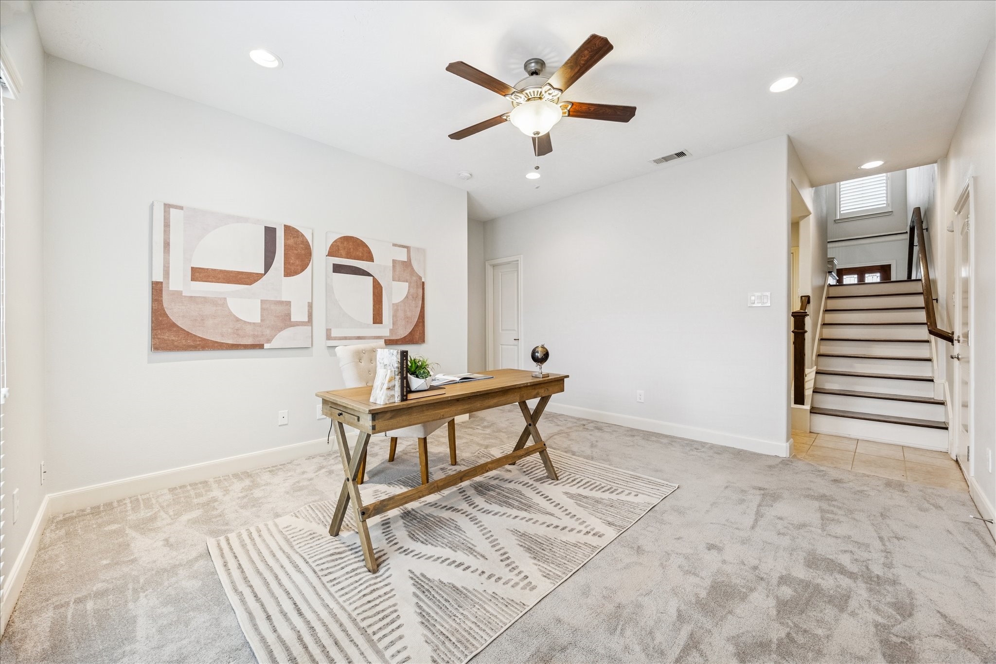 1216 Sampson Street Houston, TX 77003 - Photo 11 of 36 This spacious flex room offers plush carpeting, recessed lighting, and a modern ceiling fan.