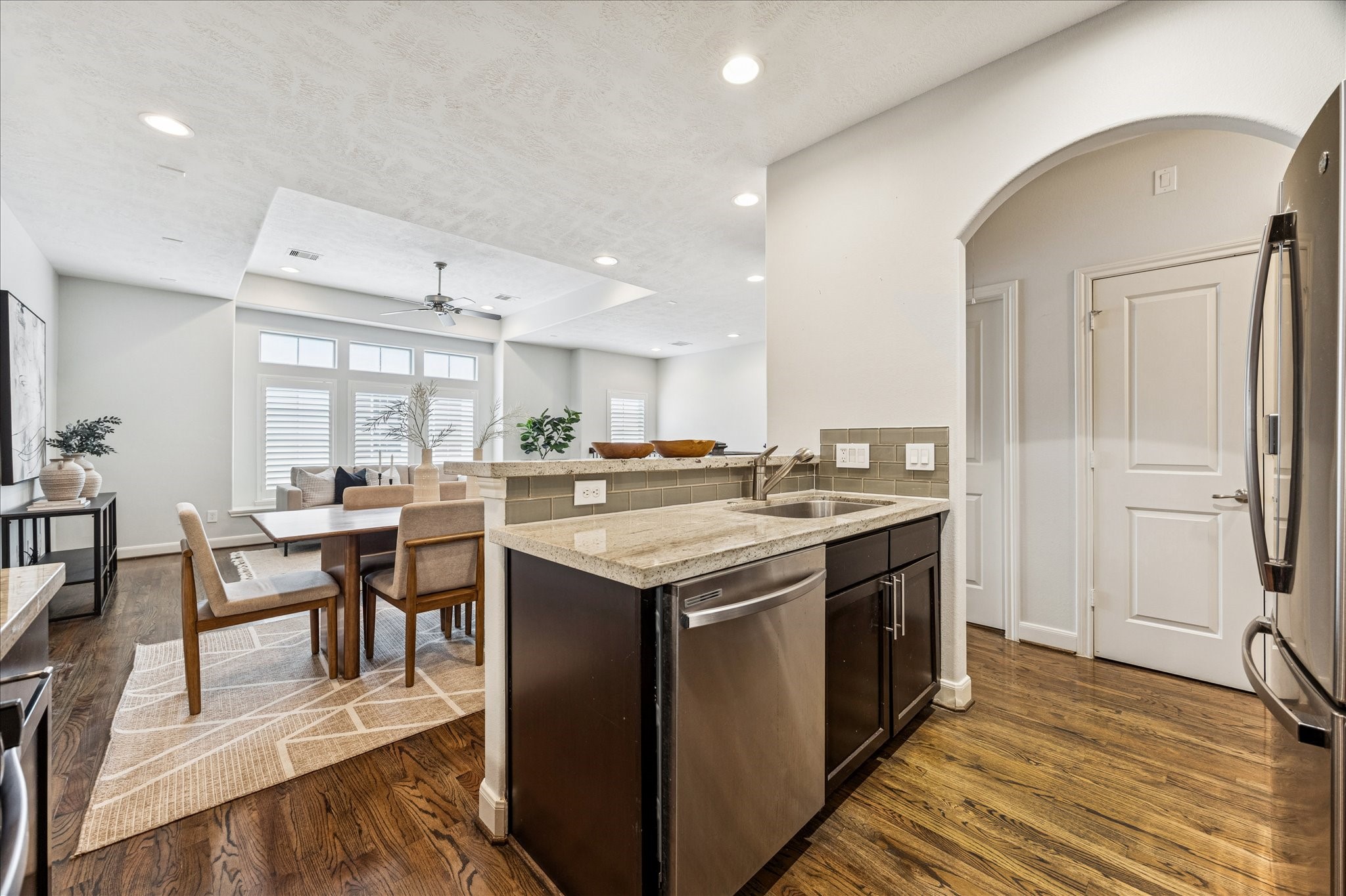 1216 Sampson Street Houston, TX 77003 - Photo 19 of 36 a kitchen with a sink and chairs