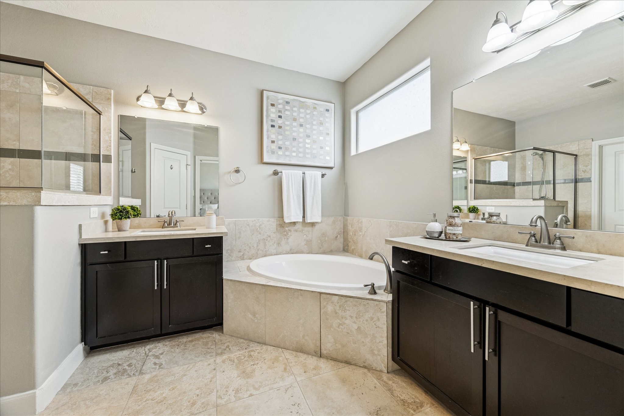 1216 Sampson Street Houston, TX 77003 - Photo 28 of 36 a bathroom with a sink double vanity granite tub shower and a mirror