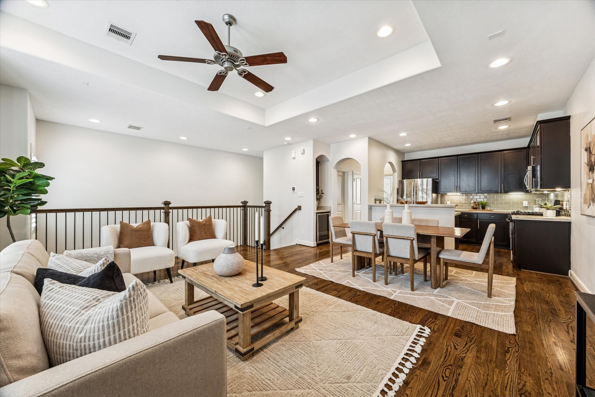 1216 Sampson Street Houston, TX 77003 - Photo 3 of 36 a living room with lots of furniture and view of kitchen