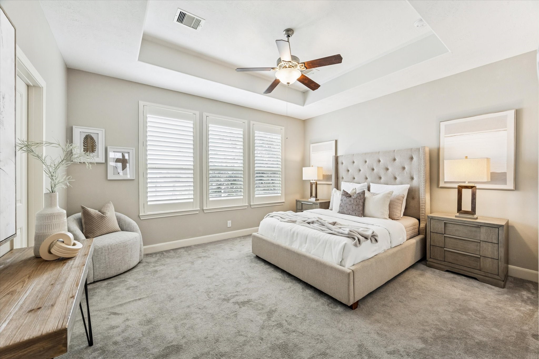 1216 Sampson Street Houston, TX 77003 - Photo 4 of 36 a spacious bedroom with a bed and a couch