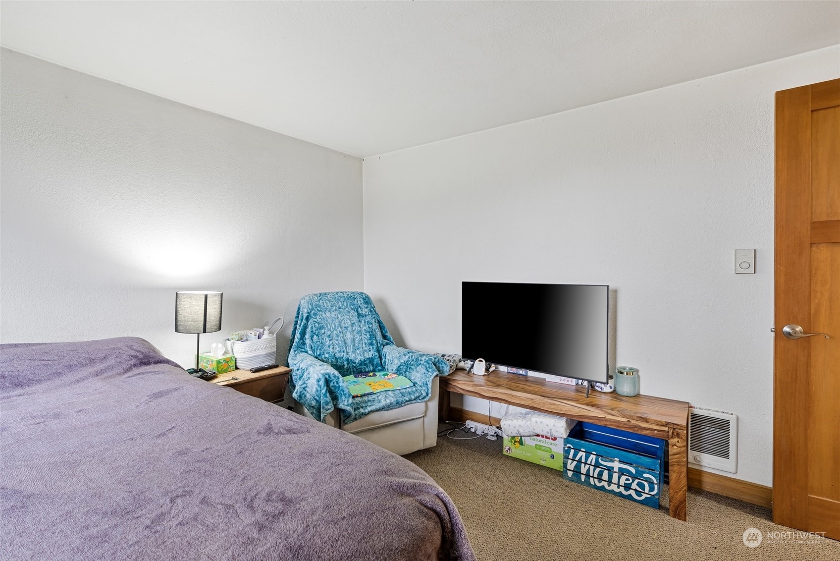 18116 Corvallis Street Southwest Rochester, WA 98579 - Photo 20 of 26 a bedroom with bed and a flat screen tv