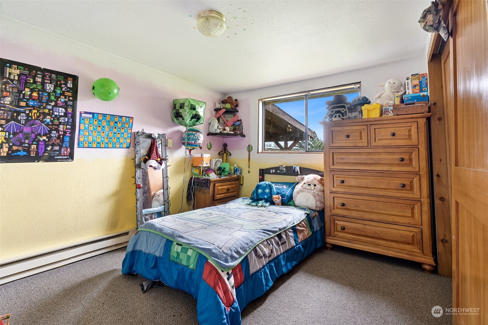18116 Corvallis Street Southwest Rochester, WA 98579 - Photo 21 of 26 a bed sitting in a bedroom next to a window