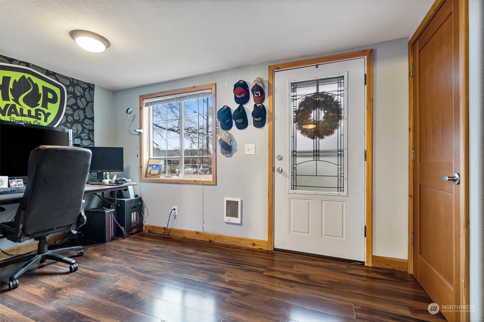 18116 Corvallis Street Southwest Rochester, WA 98579 - Photo 6 of 26 a workspace with wooden floor and furniture