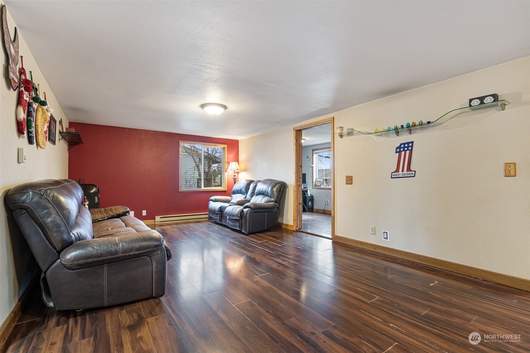 18116 Corvallis Street Southwest Rochester, WA 98579 - Photo 10 of 26 a living room with furniture and a wooden floor