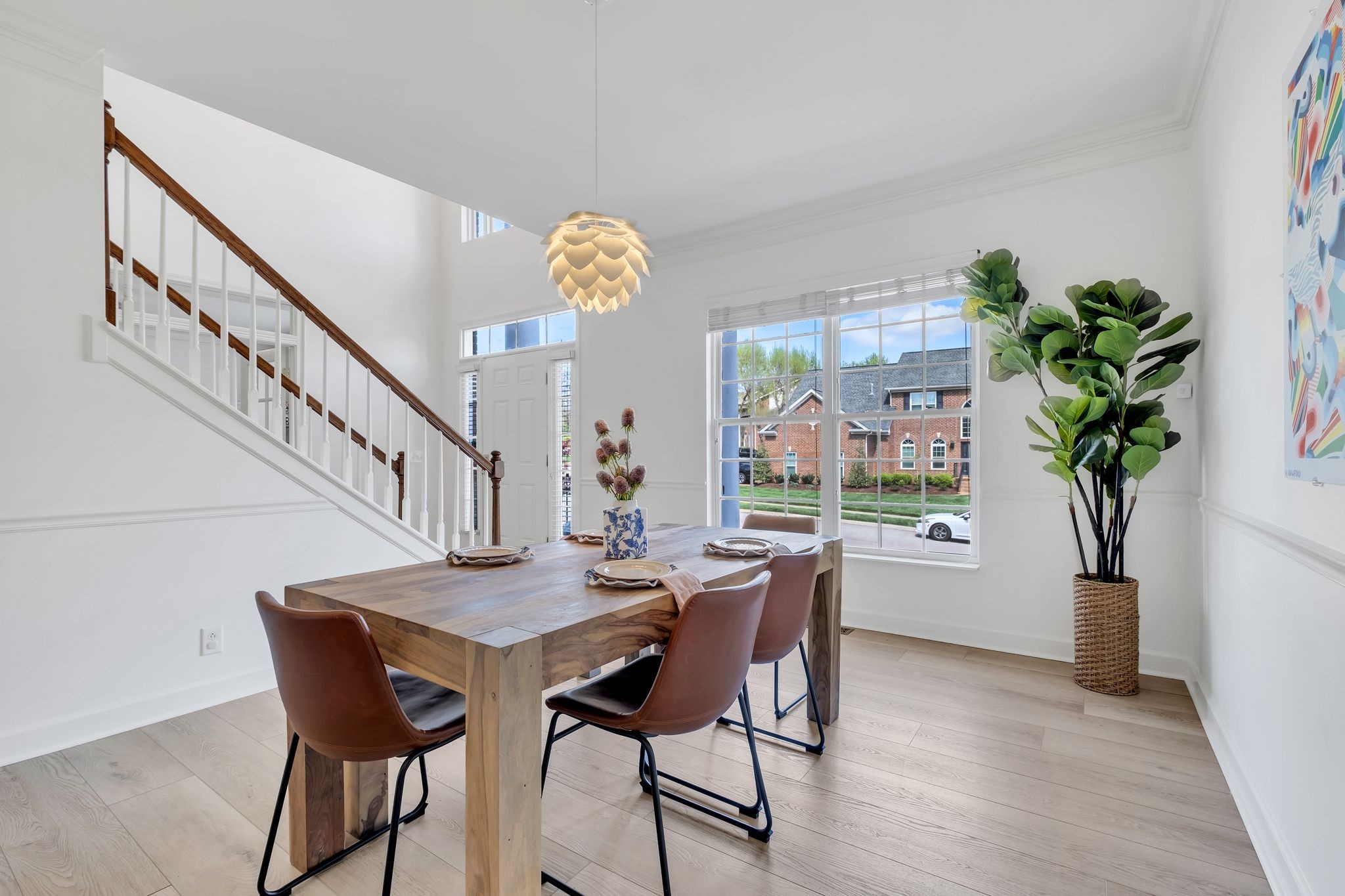 378 Logans Circle Franklin, TN 37067 - Photo 19 of 49 a view of a dining room with furniture and a potted plant
