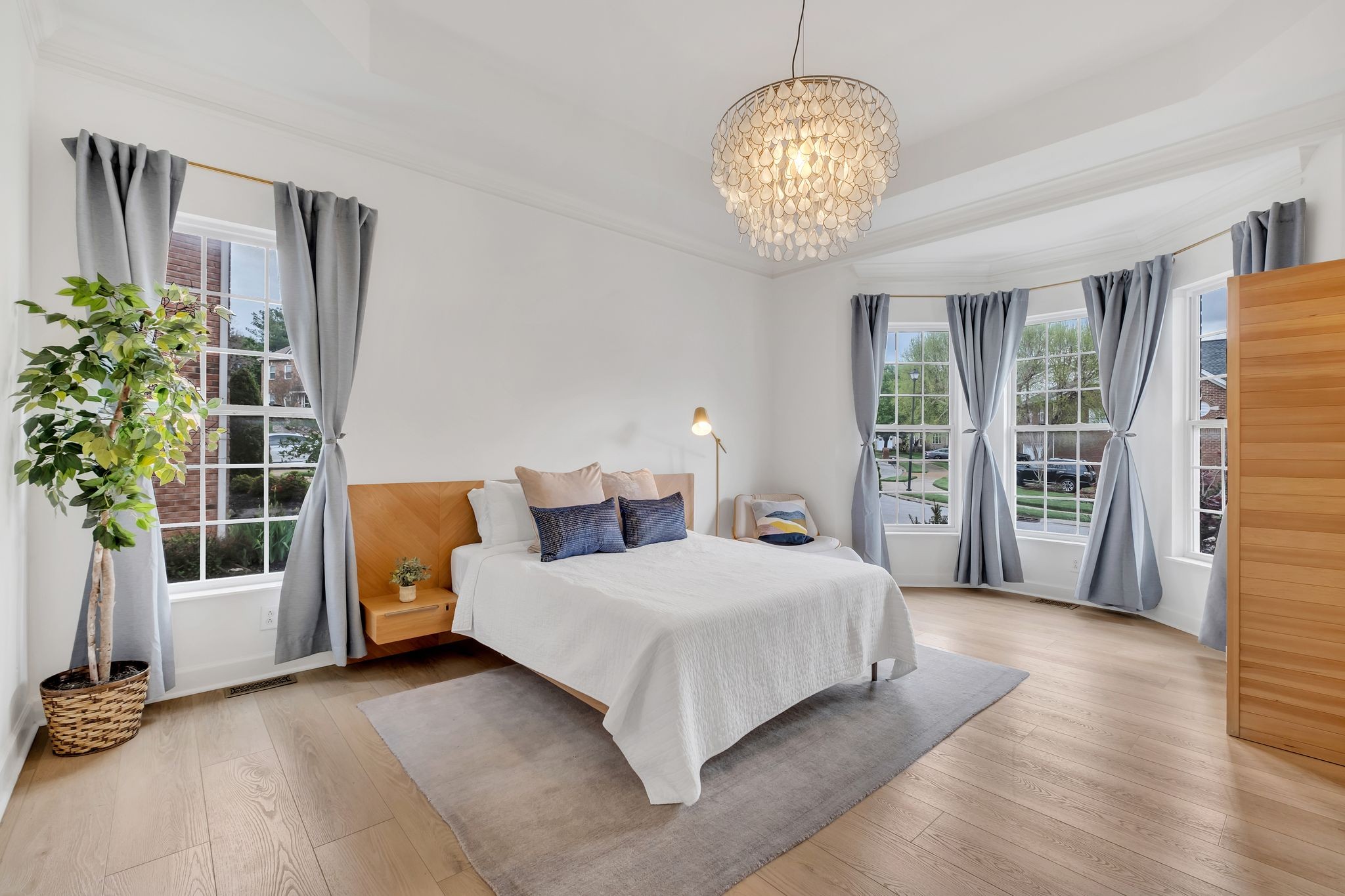 378 Logans Circle Franklin, TN 37067 - Photo 21 of 49 a bedroom with a large bed and a chandelier