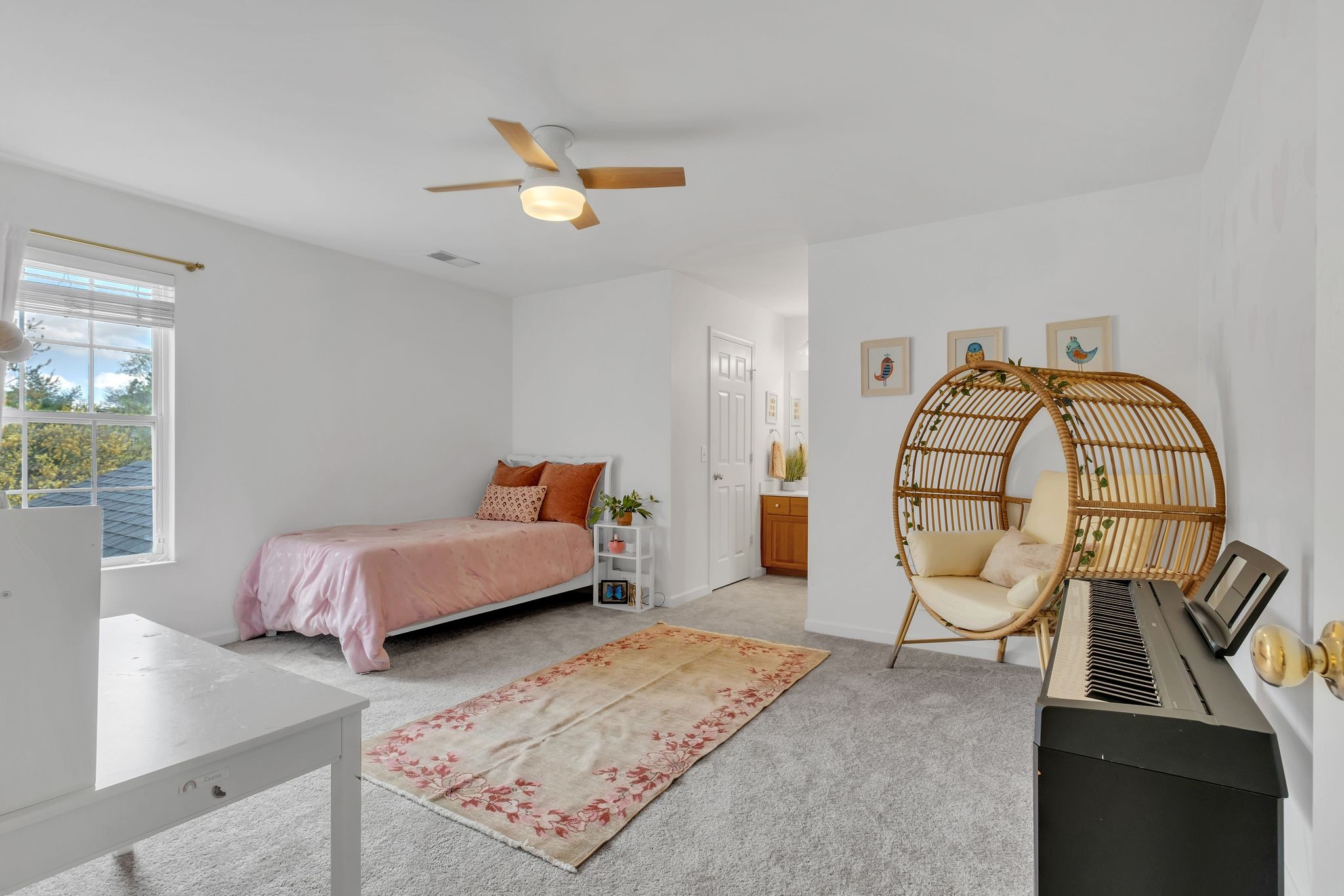 378 Logans Circle Franklin, TN 37067 - Photo 32 of 49 a spacious bedroom with a bed a couch and a window