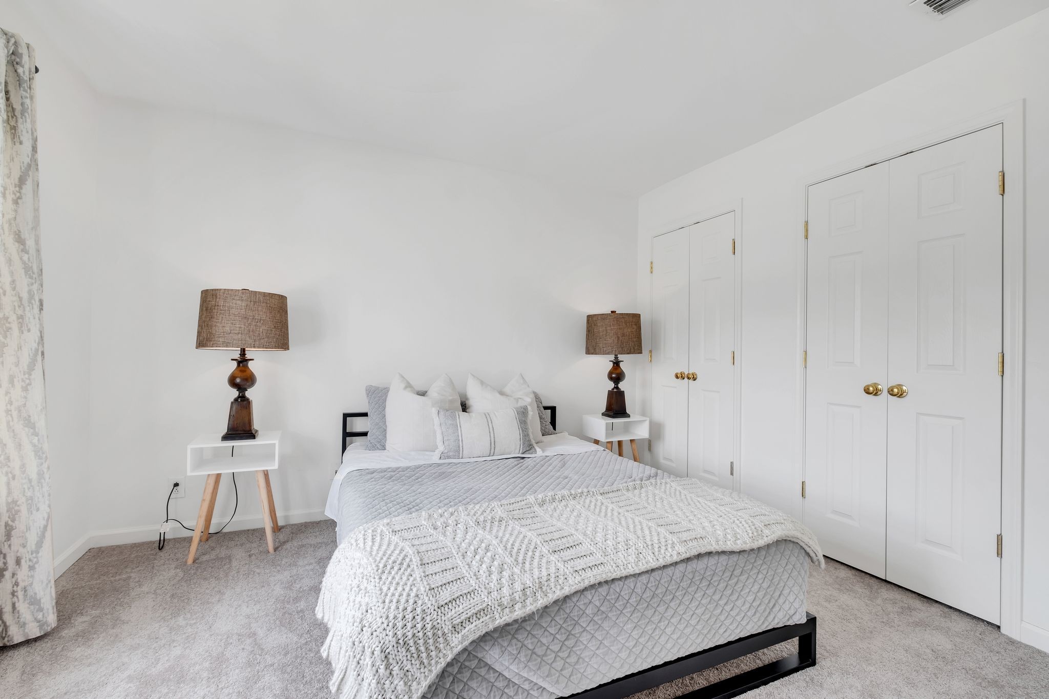 378 Logans Circle Franklin, TN 37067 - Photo 39 of 49 a bedroom with a bed and a lamp on the dresser