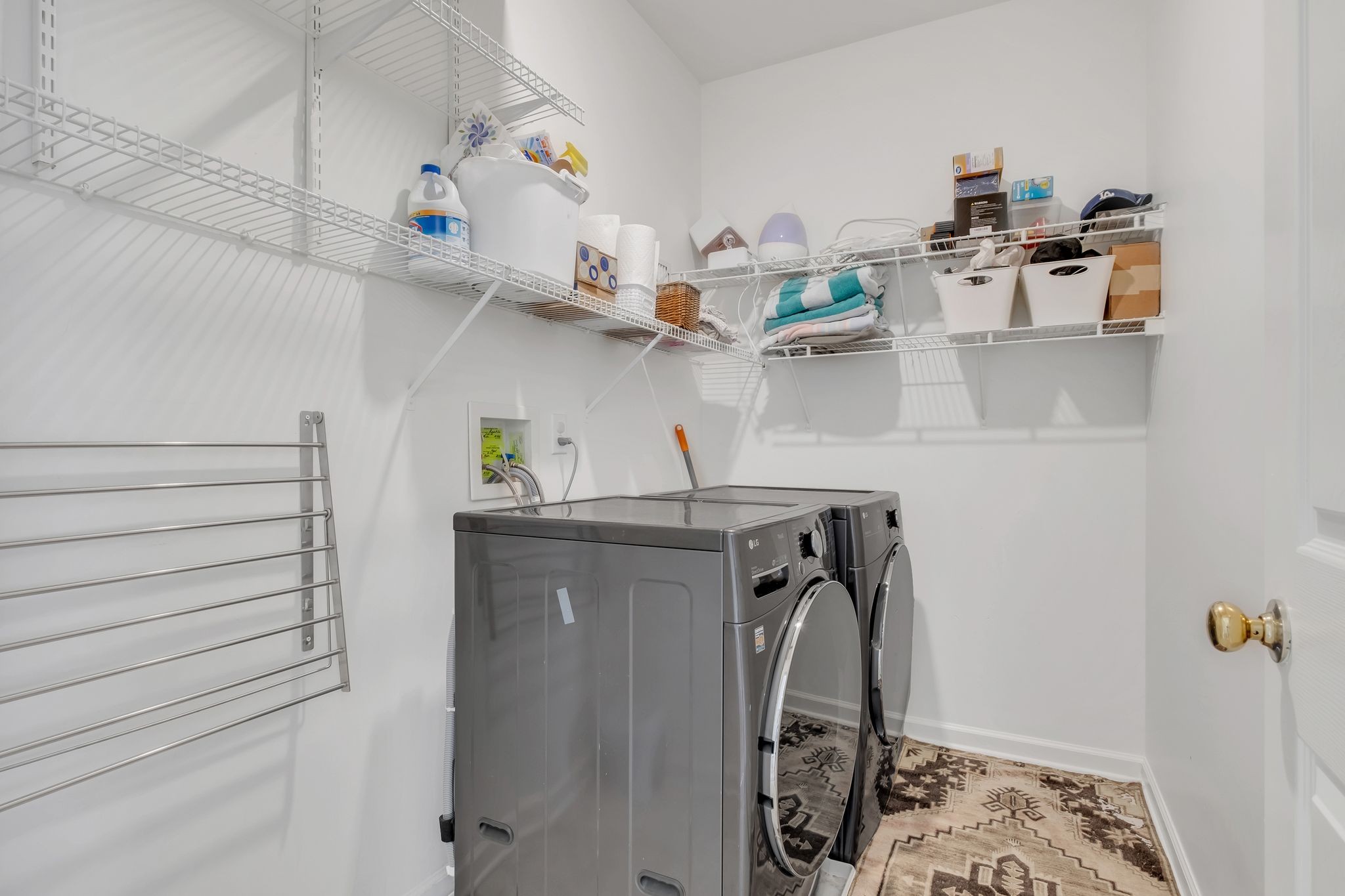 378 Logans Circle Franklin, TN 37067 - Photo 43 of 49 a view of storage and utility room with racks on the wall