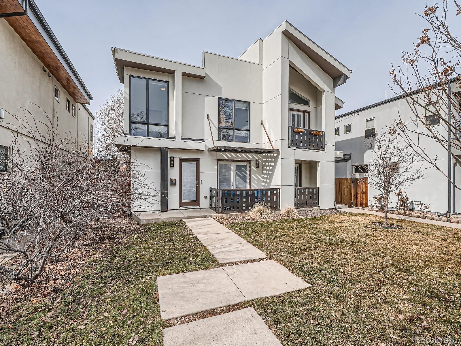 a view of a white building among the street