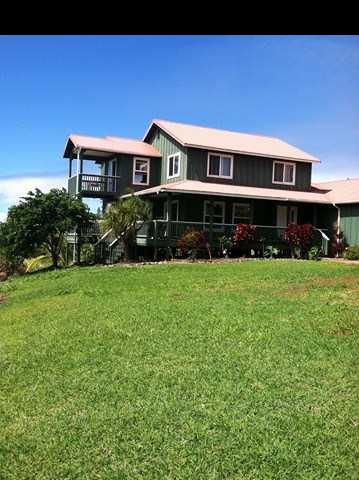1200 Kokomo Road Haiku, HI 96708 - Photo 19 of 24 a front view of a house with garden and trees
