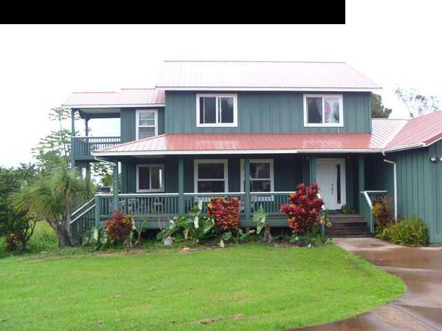 1200 Kokomo Road Haiku, HI 96708 - Photo 2 of 24 a front view of a house with garden