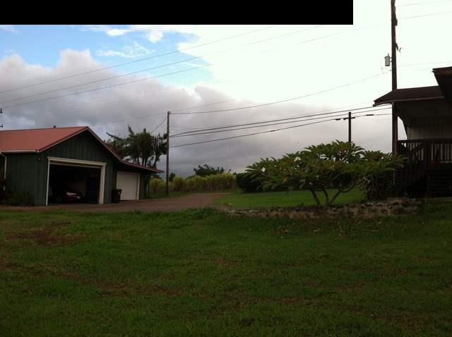1200 Kokomo Road Haiku, HI 96708 - Photo 21 of 24 a front view of a house with garden