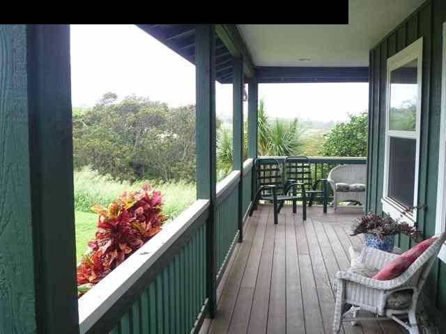 1200 Kokomo Road Haiku, HI 96708 - Photo 7 of 24 a view of a balcony with chairs and a potted plant
