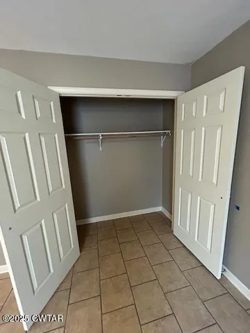 a view of an empty walk in closet