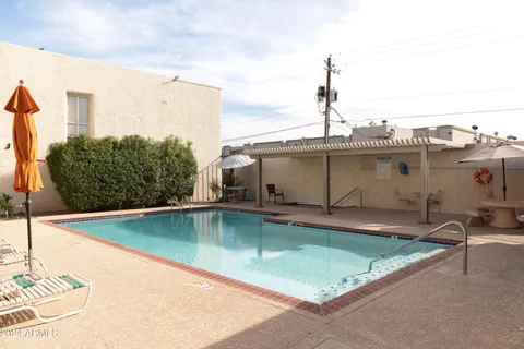 a view of a swimming pool with a chair