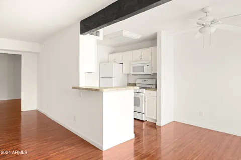 a view of kitchen with wooden floor