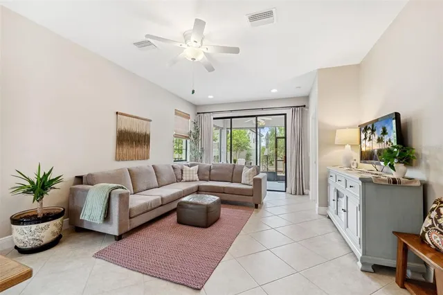 a living room with couch and a table