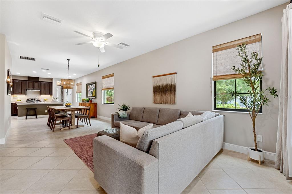 3877 Burdick Loop Odessa, FL 33556 - Photo 19 of 64 a living room with furniture and a large window