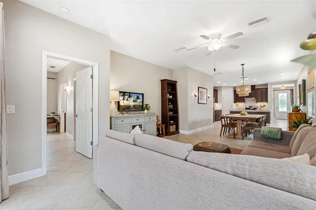 a spacious bedroom with a bed and cabinets