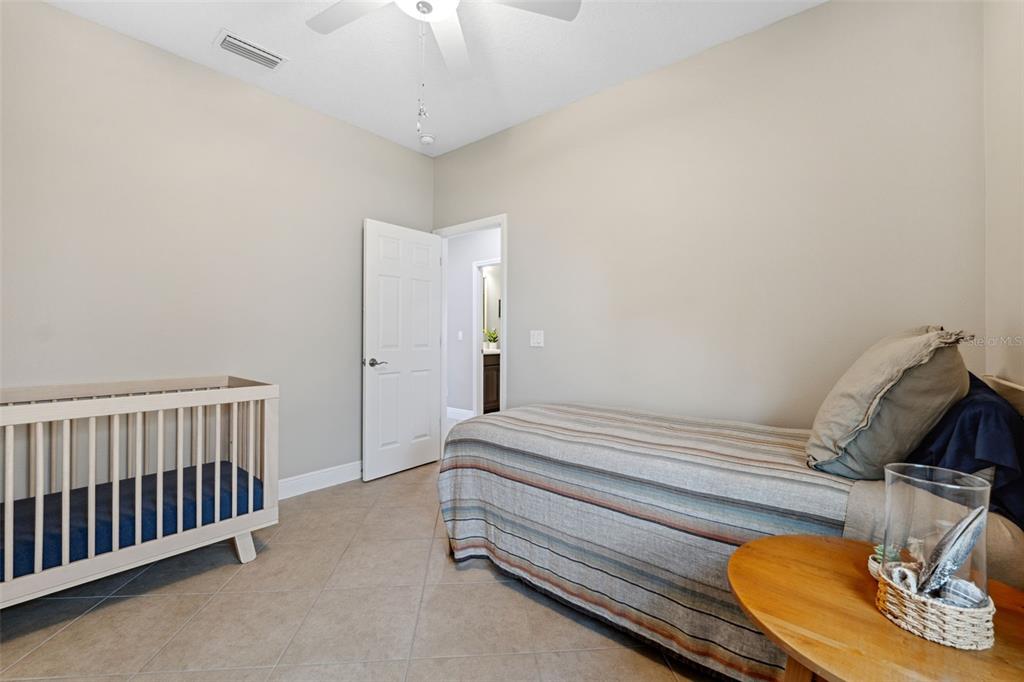 3877 Burdick Loop Odessa, FL 33556 - Photo 30 of 64 a bedroom with bed and a window