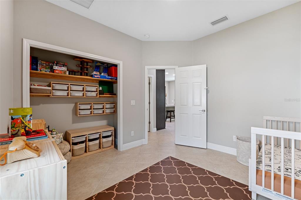 3877 Burdick Loop Odessa, FL 33556 - Photo 33 of 64 a view of a livingroom with shelves
